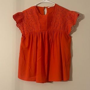 Ellison orange shirt.  Dressy with heels or casual with jeans.